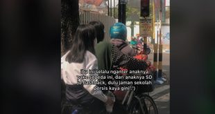 ibu antar anak sekolah naik sepeda