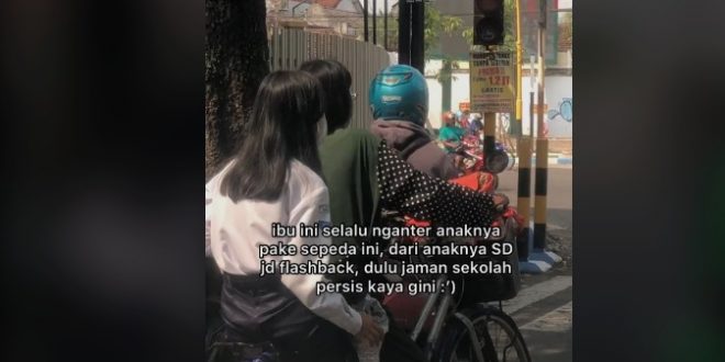 ibu antar anak sekolah naik sepeda